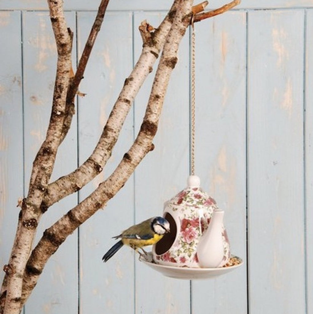 red floral hanging teapot bird feeder