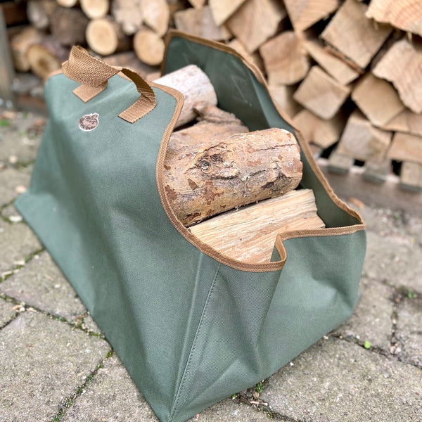 olive green log carrier by fallen fruits