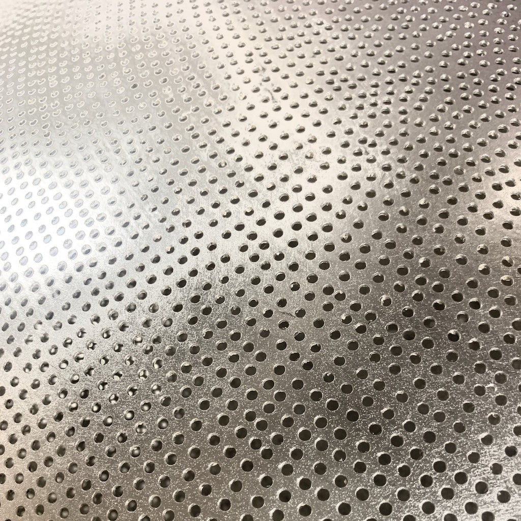 detail of the punched hole pattern on the silver pendant light 