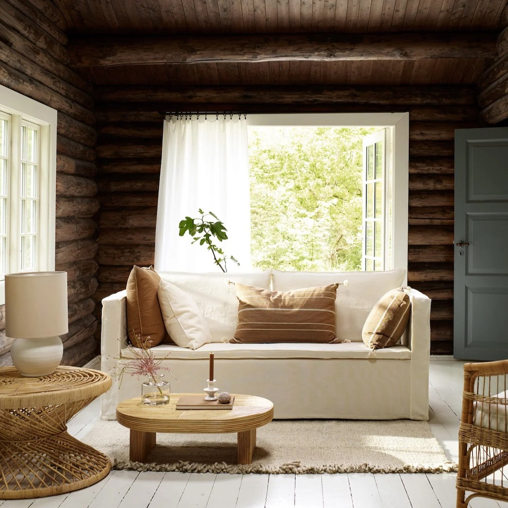 Tine K white linen sofa with brown cushions