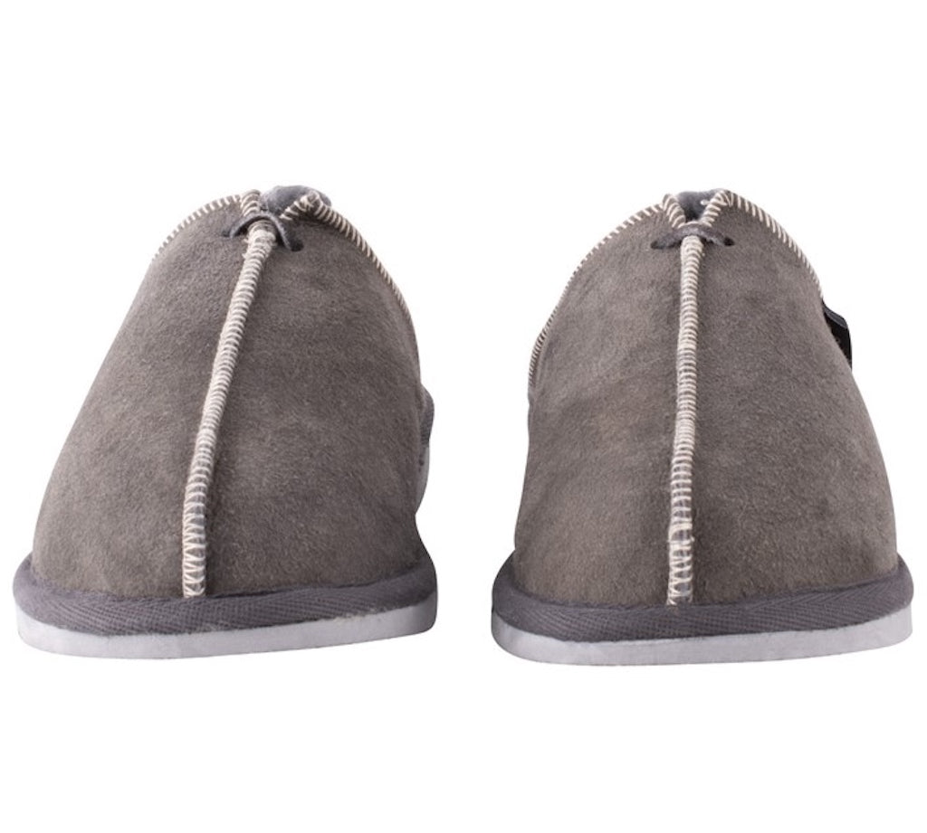 Pair of gray slippers with white soles on a white background