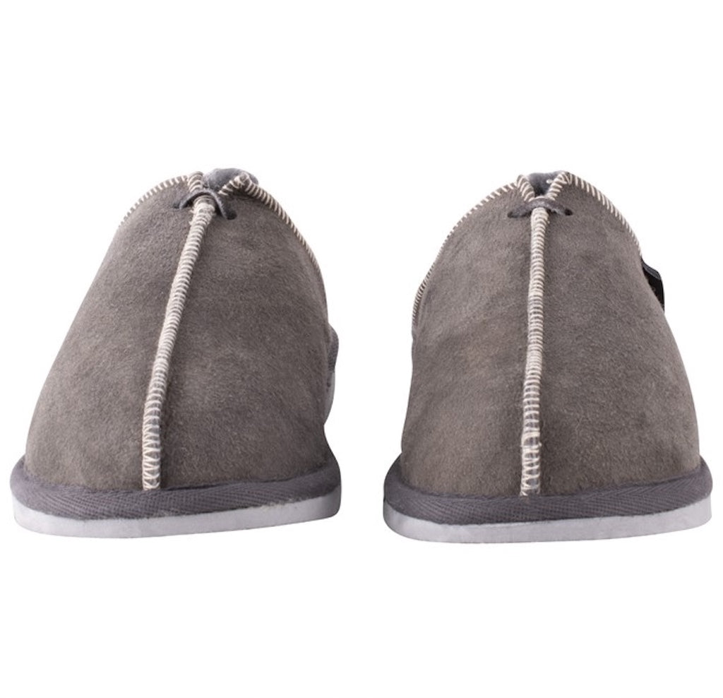 Pair of gray slippers with white soles on a white background