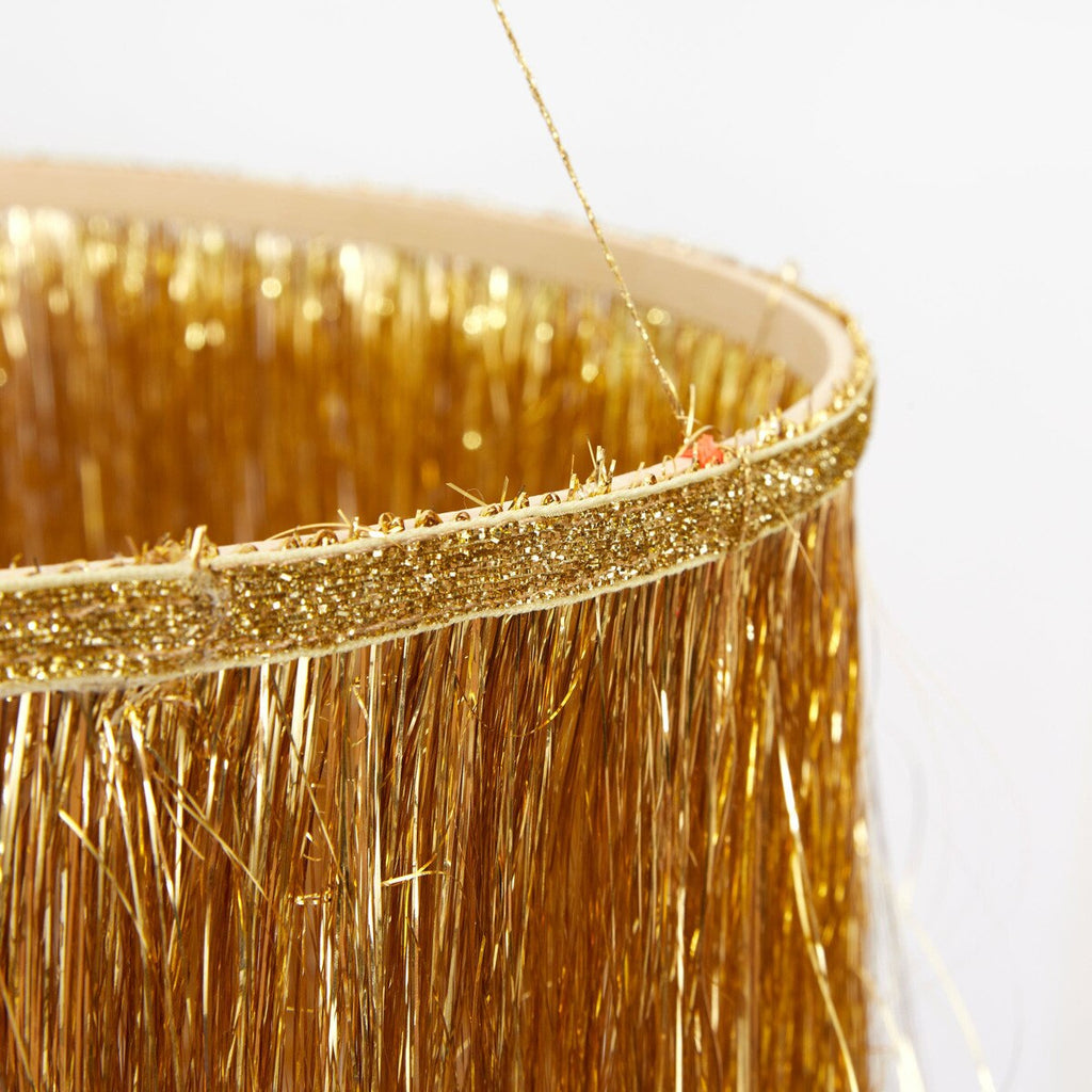 detail of gold tinsel chandelier by MERI MERI