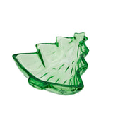 A green glass dish shaped like a stylized leaf, shown on a plain white background.