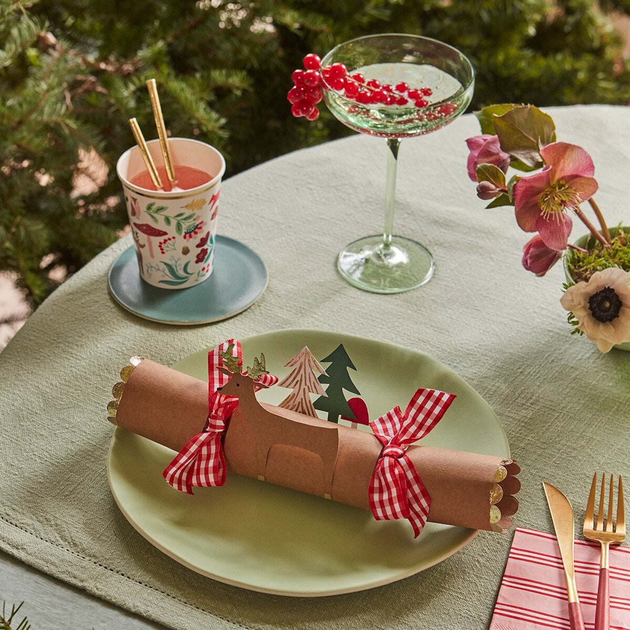 festive table setting with reindeer cracker detail