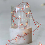 red jewel cluster lights in vase