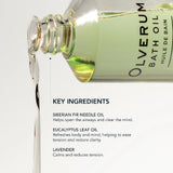 Olverum bath oil bottle with key ingredients listed on a white background