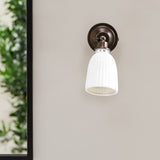 Alma bathroom wall light in bronze by Garden Trading