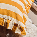 Close-up of a orange and beige striped fabric cushion