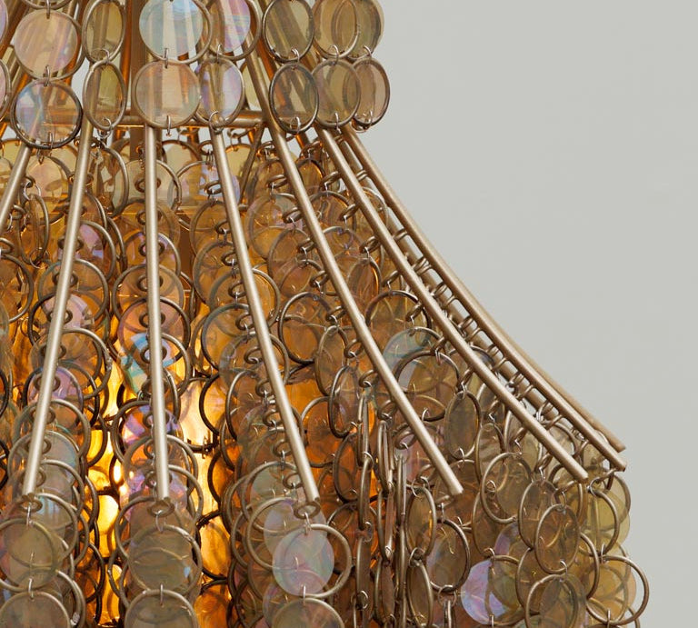 Close-up of a decorative chandelier with circular components.