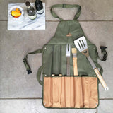 Green apron with BBQ tools on a concrete surface