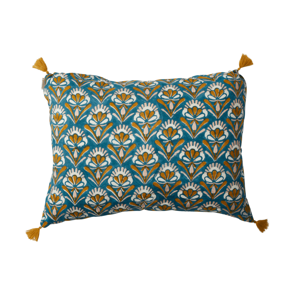 Decorative pillow with floral pattern and tassels on a white background