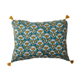 Decorative pillow with floral pattern and tassels on a white background