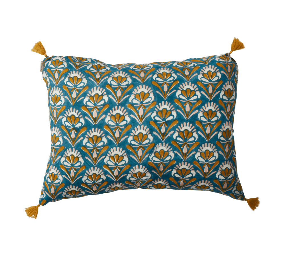 Decorative pillow with floral pattern and tassels on a white background