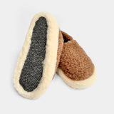 Pair of brown slippers with textured sole on a light gray background