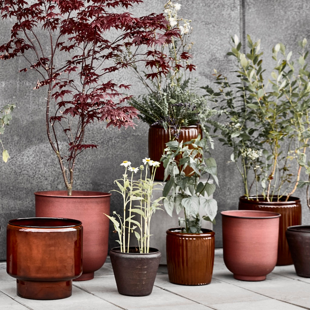 collection of brown plant pots by House Doctor 