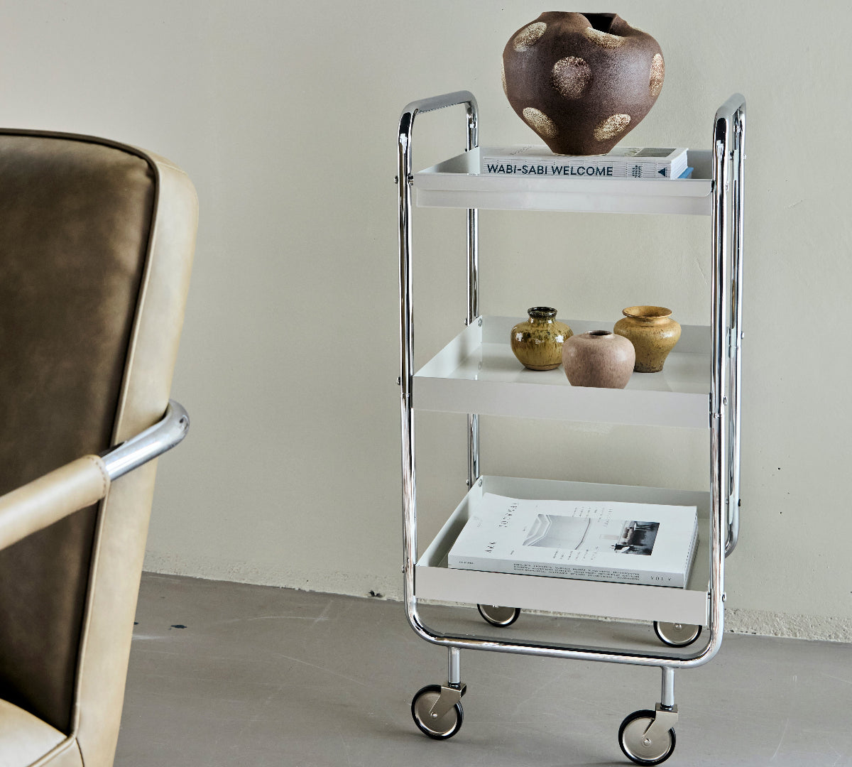 Wheeled chrome trolley cart with decortive ornaments