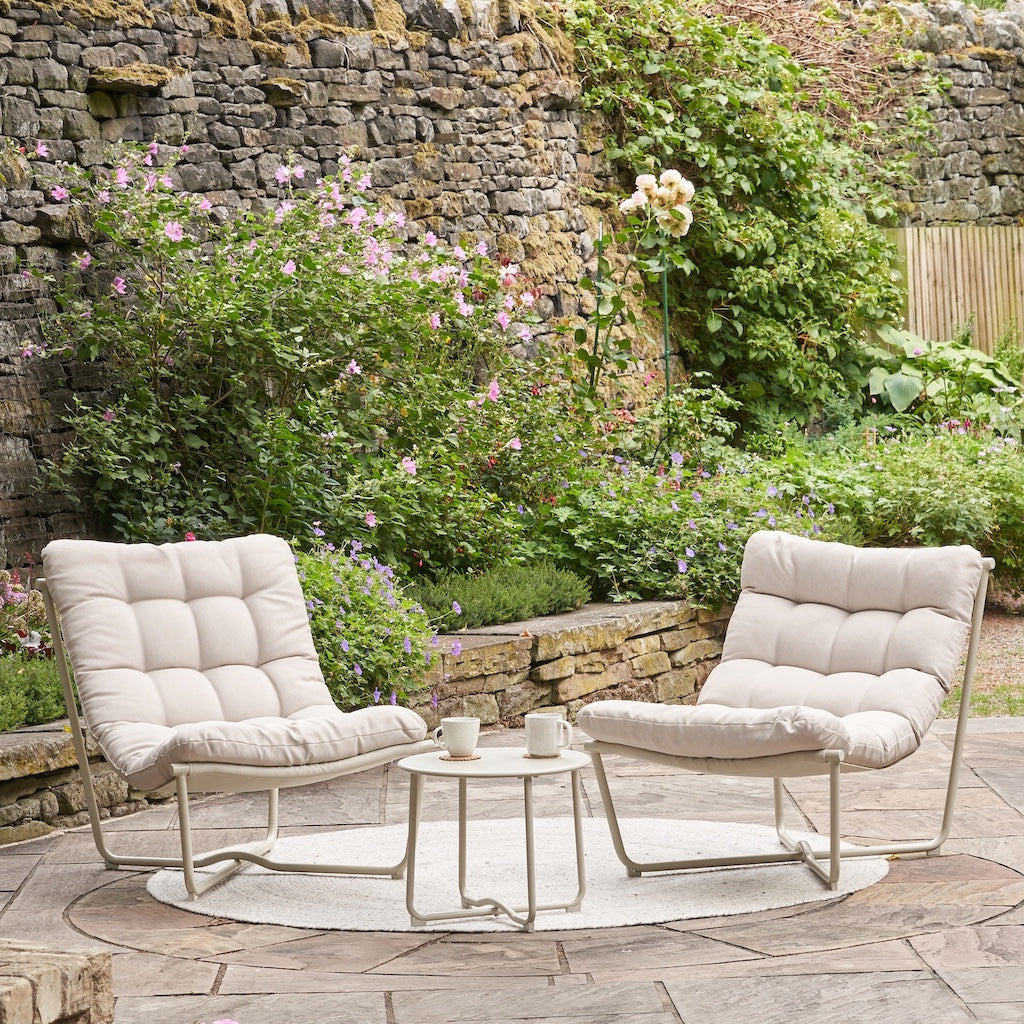outdoor lounge chairs and coffee table in beige fabric