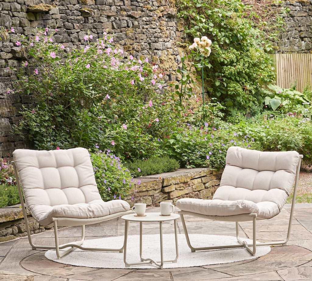 outdoor lounge chairs and coffee table in beige fabric