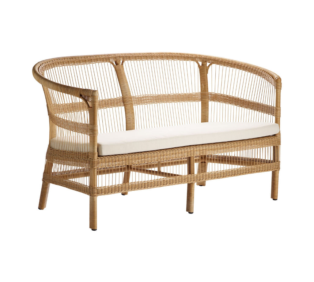 rattan sofa with white cushion on a white background