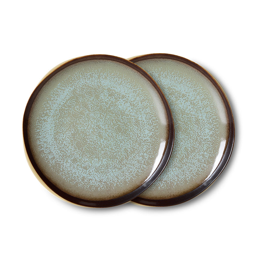 Two ceramic plates with a textured surface and brown rim on a white background