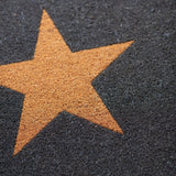 Doormat with a brown star on a textured surface