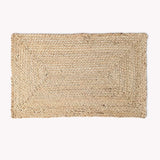 Woven natural fiber mat on a white background