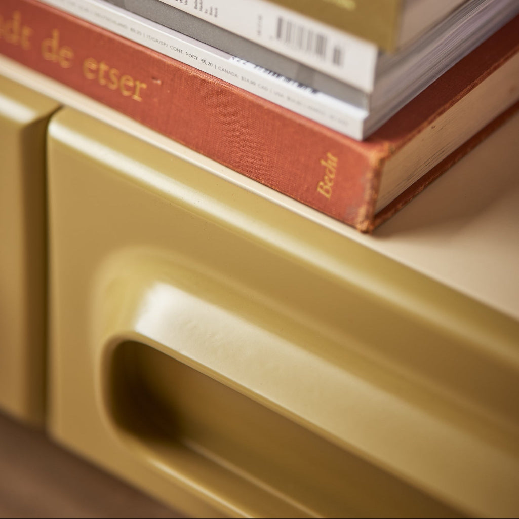 Stack of books on a beige surface