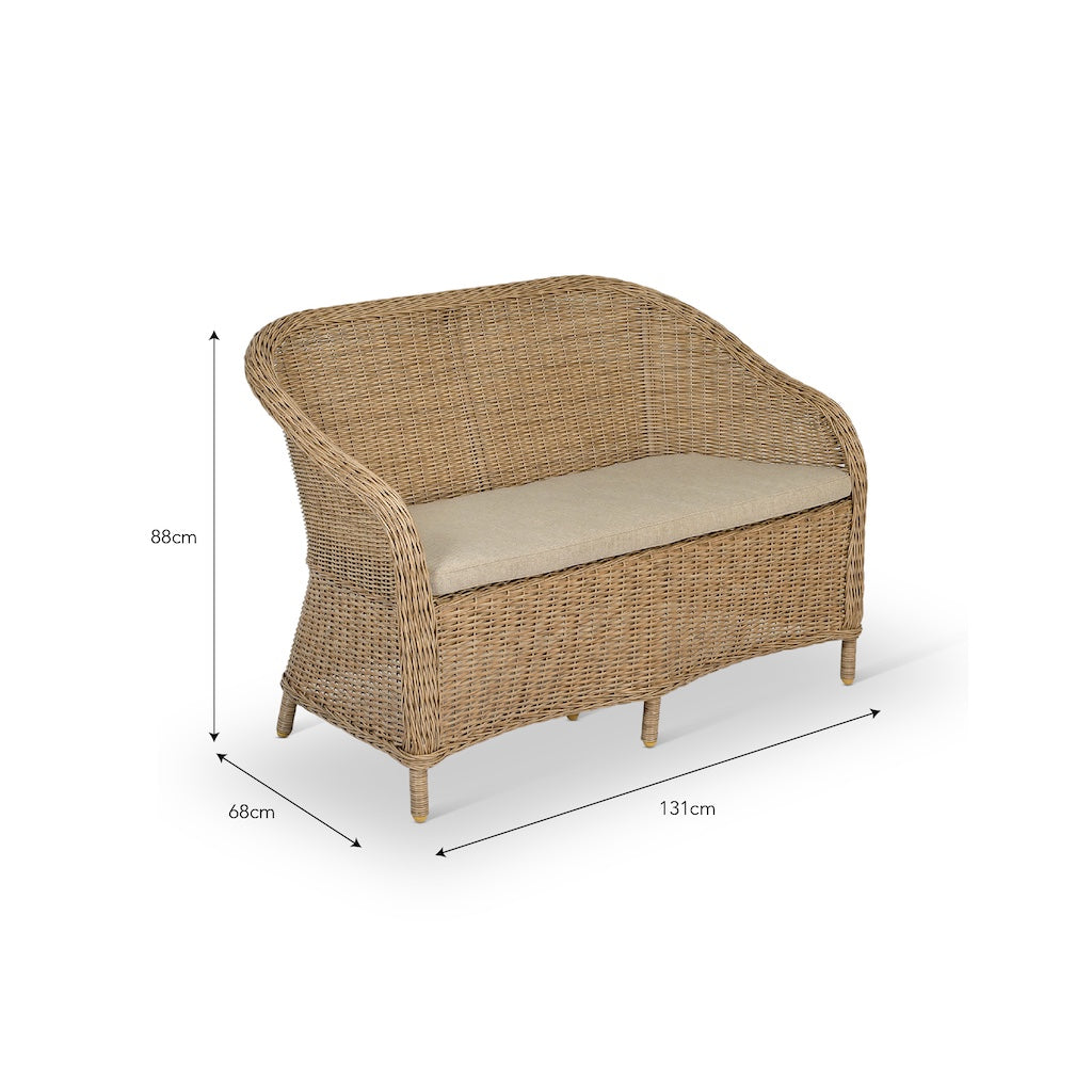 Rattan sofa with beige cushion and dimensions on a white background