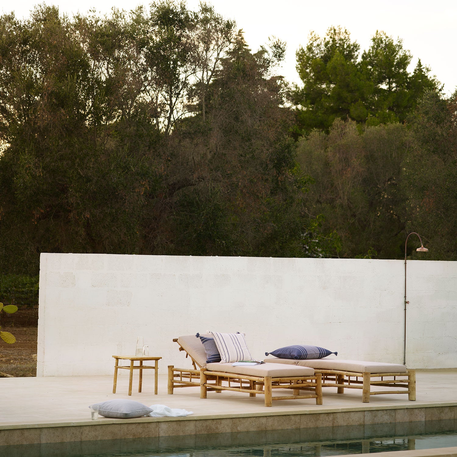 bamboo sun loungers with sand cushion