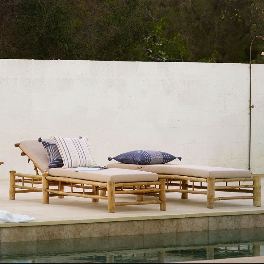 bamboo sun loungers with sand cushion