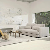 Modern living room with a gray sofa, chairs, and a coffee table.