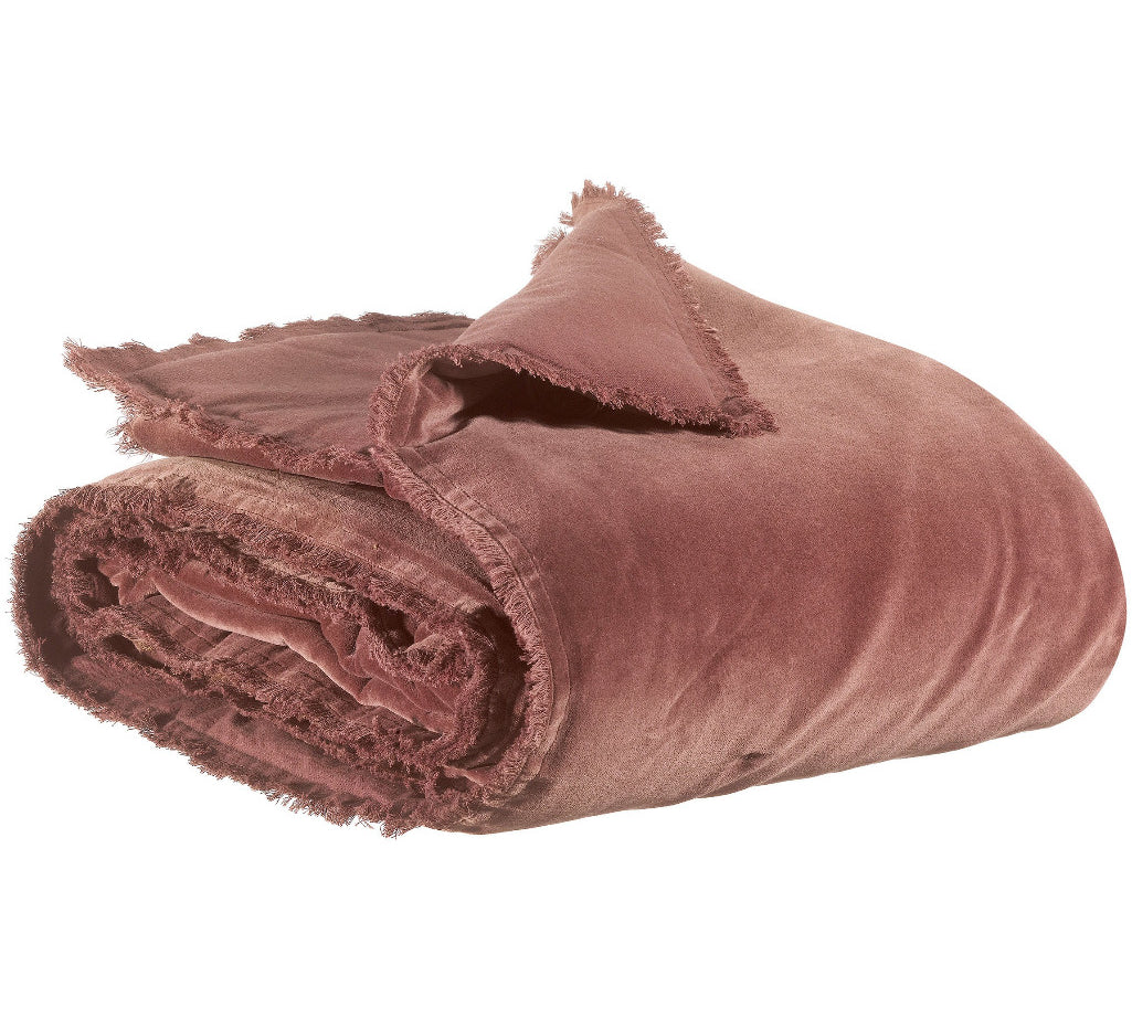 A dusty brown  throw blanket with frayed edges, shown rolled up on a solid white background.