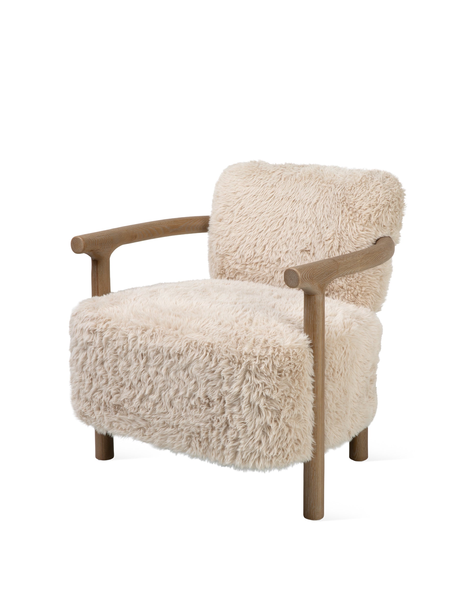 A modern accent chair featuring a thick, shaggy cream-colored sheepskin or faux fur upholstery with a natural light brown wooden frame and curved armrests, shown against a solid white background.