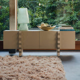 Modern interior with a large window side cabinet and lamp