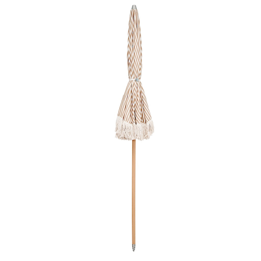 beige and white striped garden unmbrella 