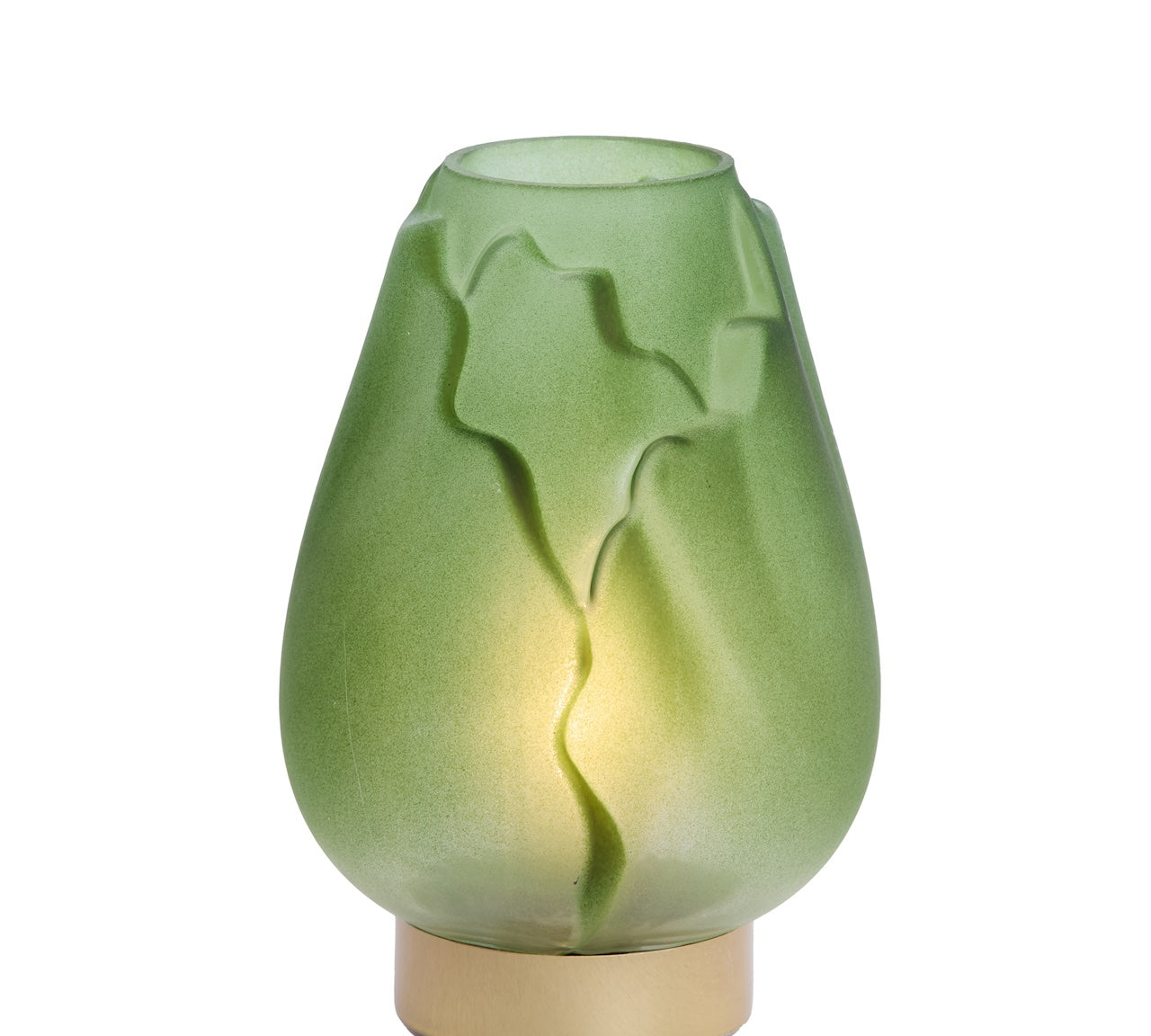 Green glass lamp with leaf patterns on a white background
