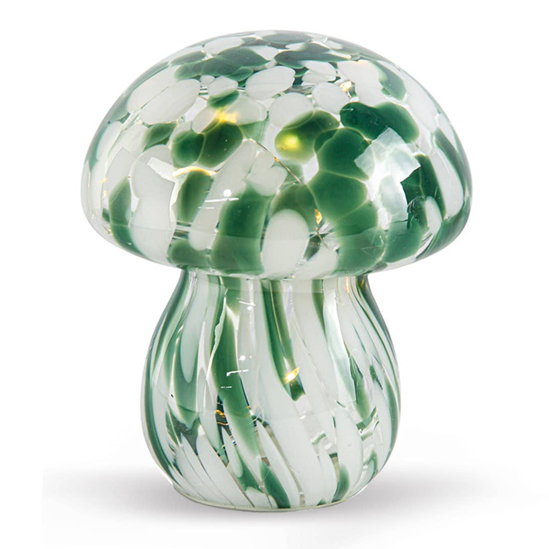 Glass mushroom lamp with green and white pattern on a white background