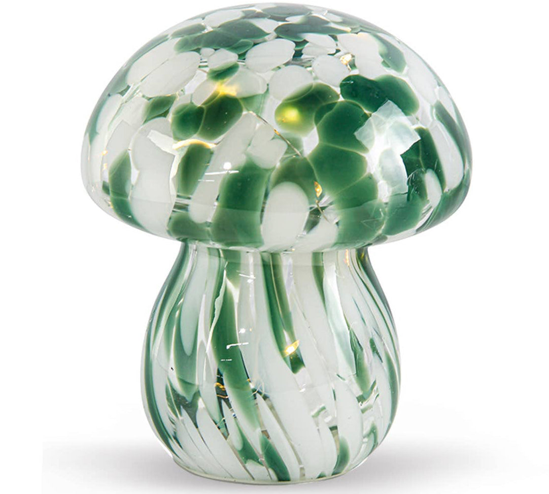 Glass mushroom lamp with green and white pattern on a white background