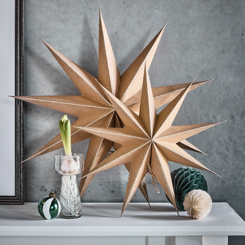 Large gold glitter paper stars 