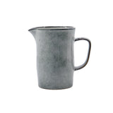 Grey ceramic pitcher on a white background