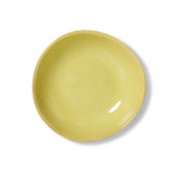 Yellow ceramic bowl on a white background