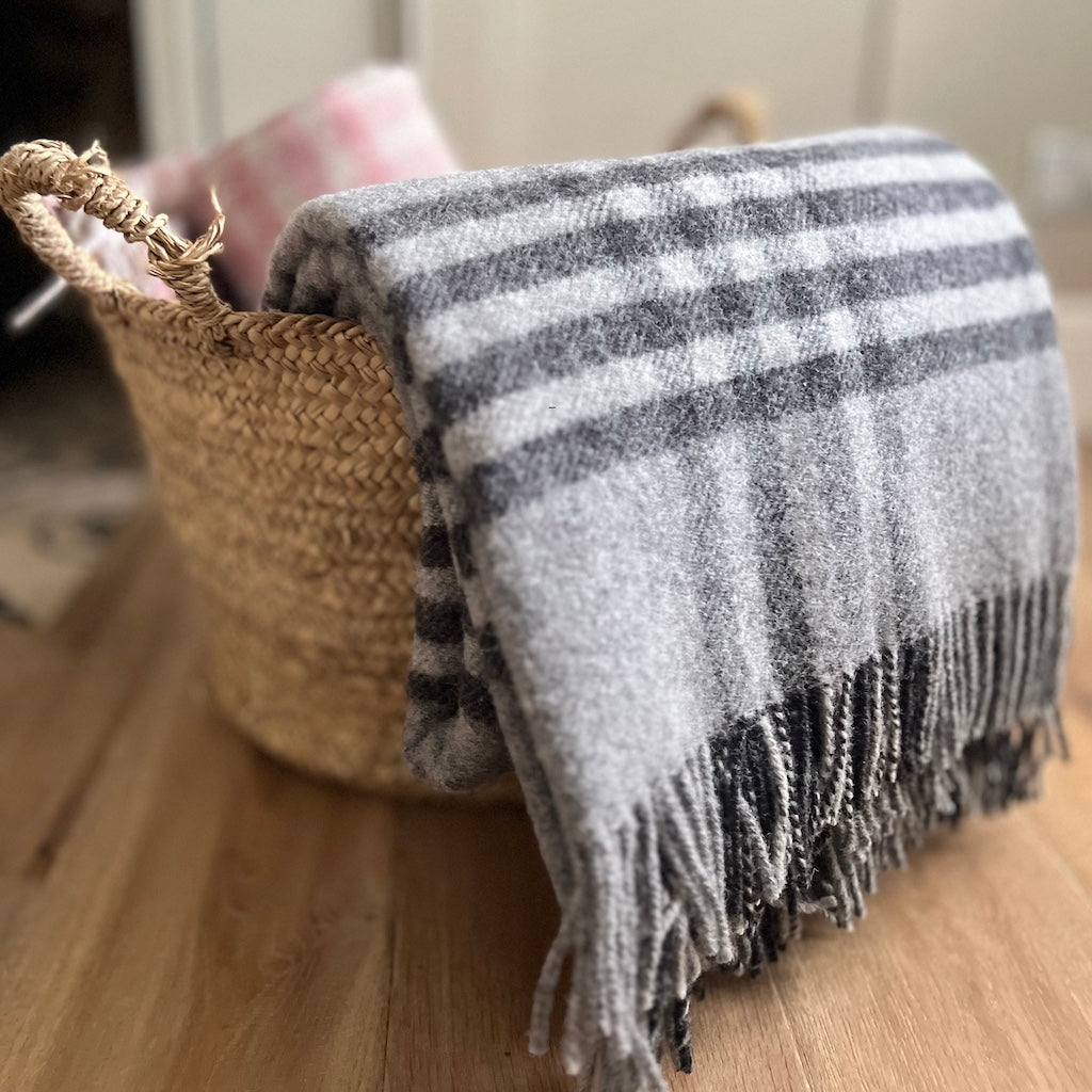 Grey hex check wool throw by Tweedmill