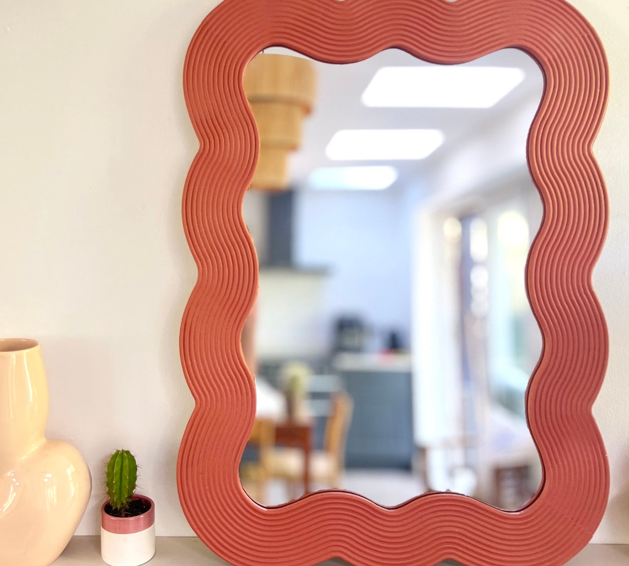red wooden mirror