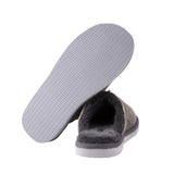 Gray slipper with textured sole on a white background