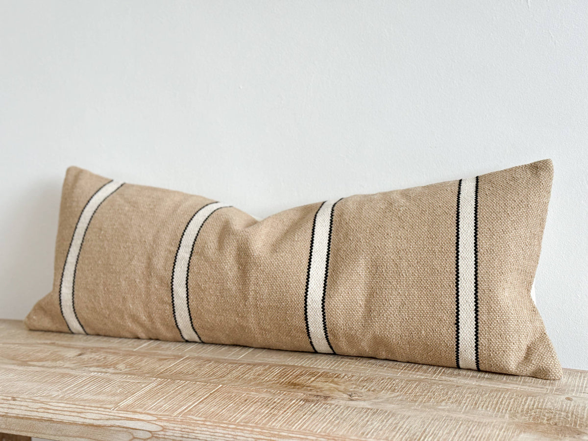 Textured thick cotton long Cushion in a neutral beige with a black and white stripe