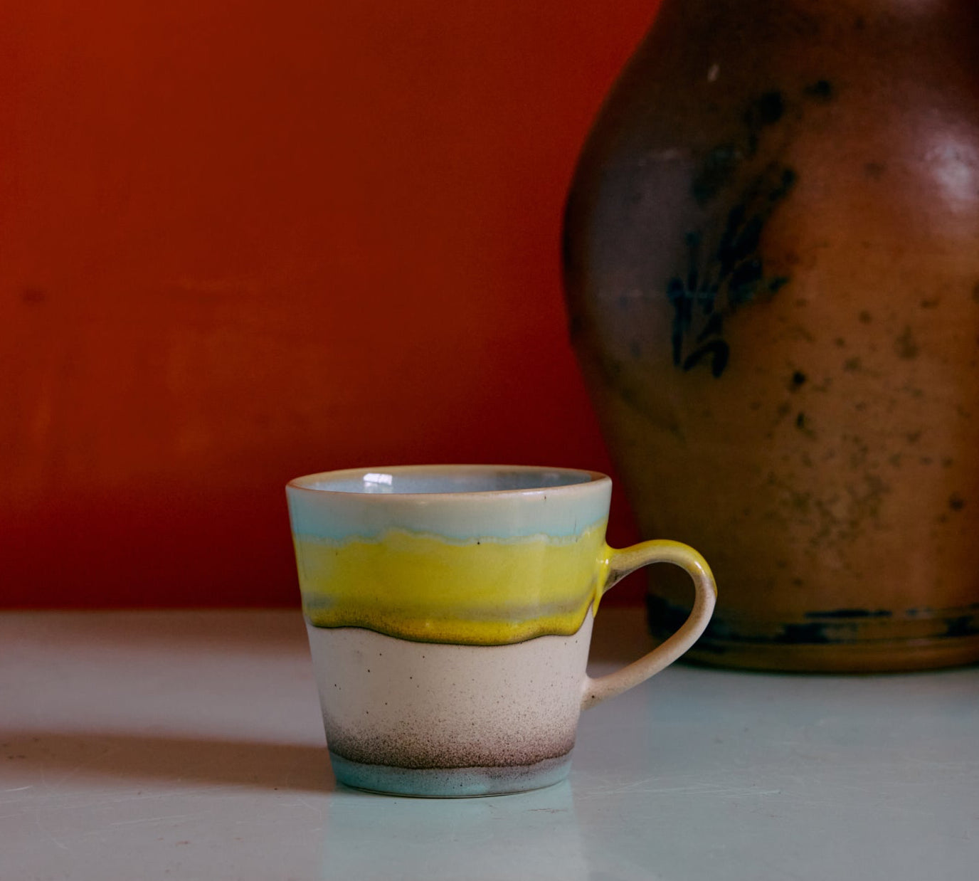 1970's Ceramic cup with yellow and blue stripes