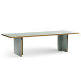 Rectangular table with a light wood top and gray legs on a white background