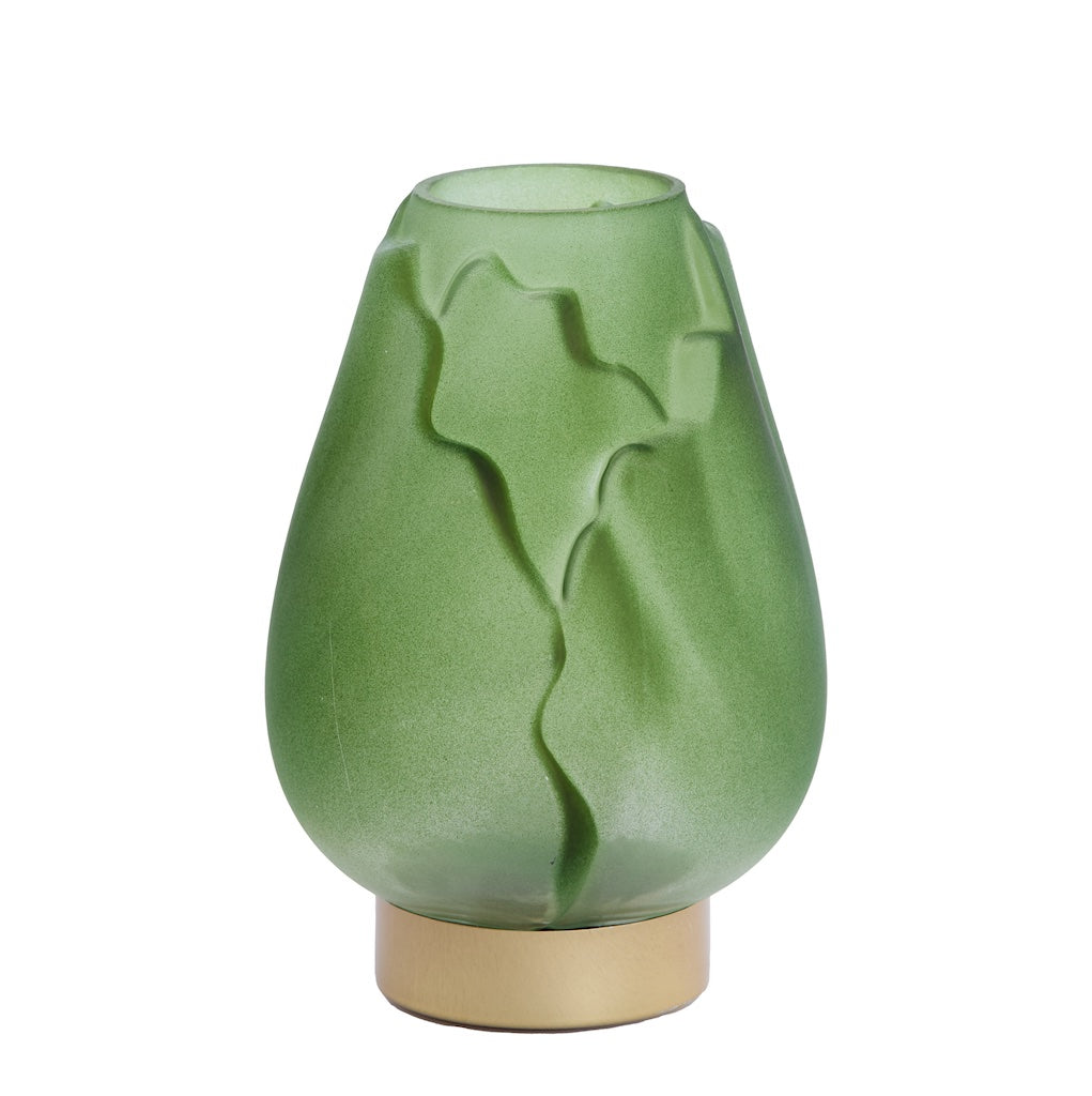 Green glass table lamps with textured design on a white background