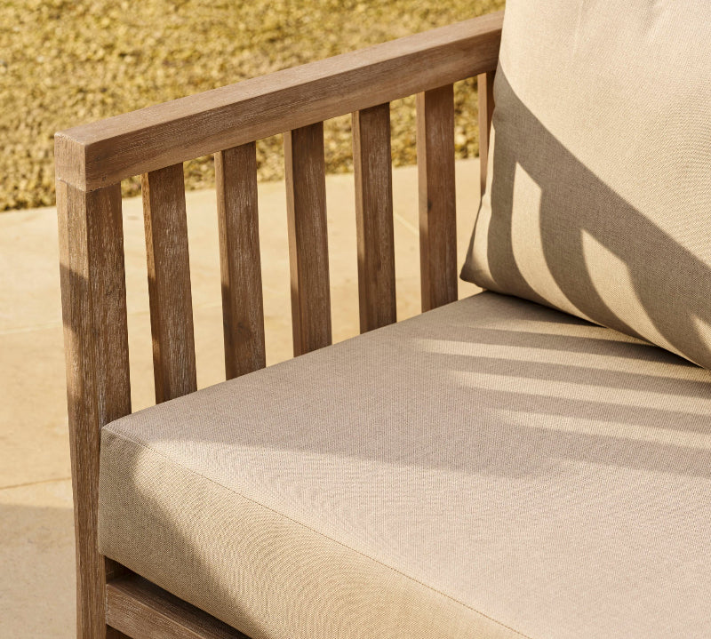 Porthallow outdoor sofa with beige cushions